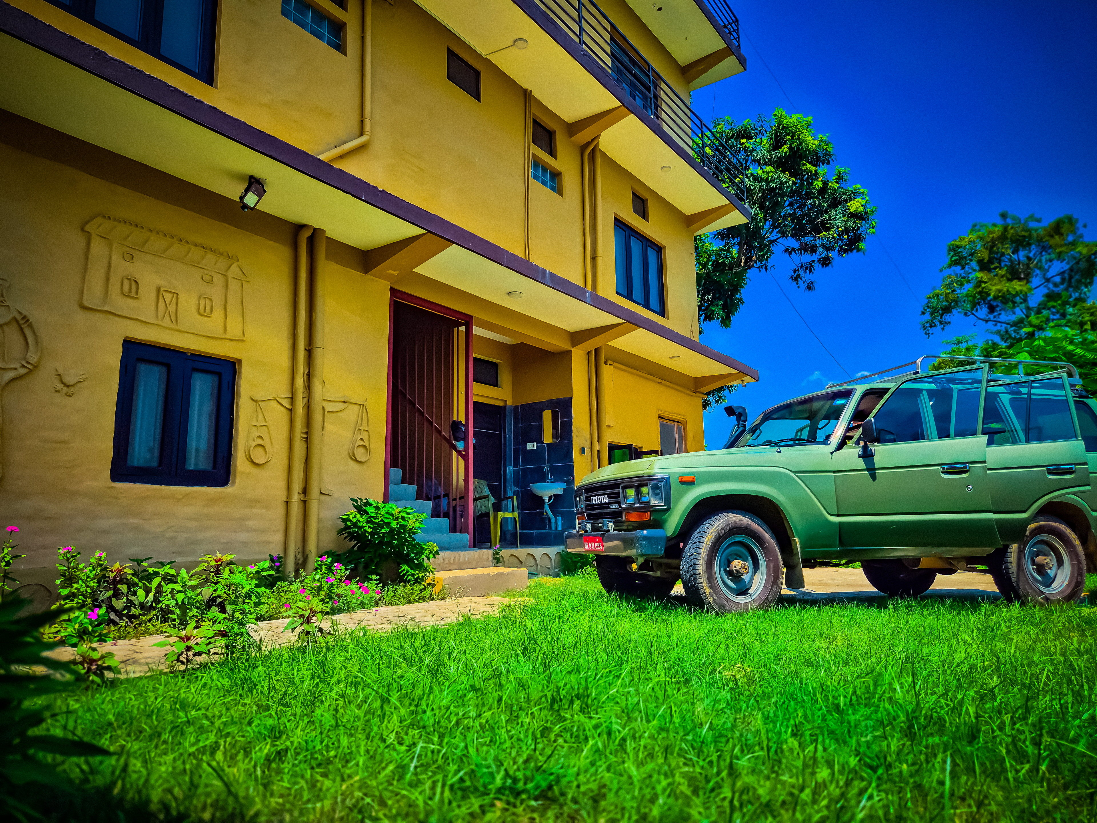 view of babaioutback room at night with outdoor lighting